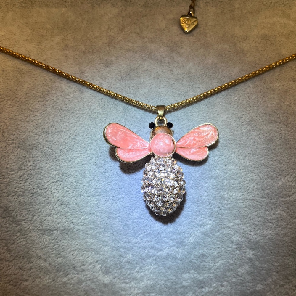 Betsey Johnson, pink enamel wings with rhinestone body